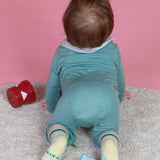 Blue Q baby socks featuring Cuddle Bug and Cry Baby designs, soft fabric and colorful patterns for infants.