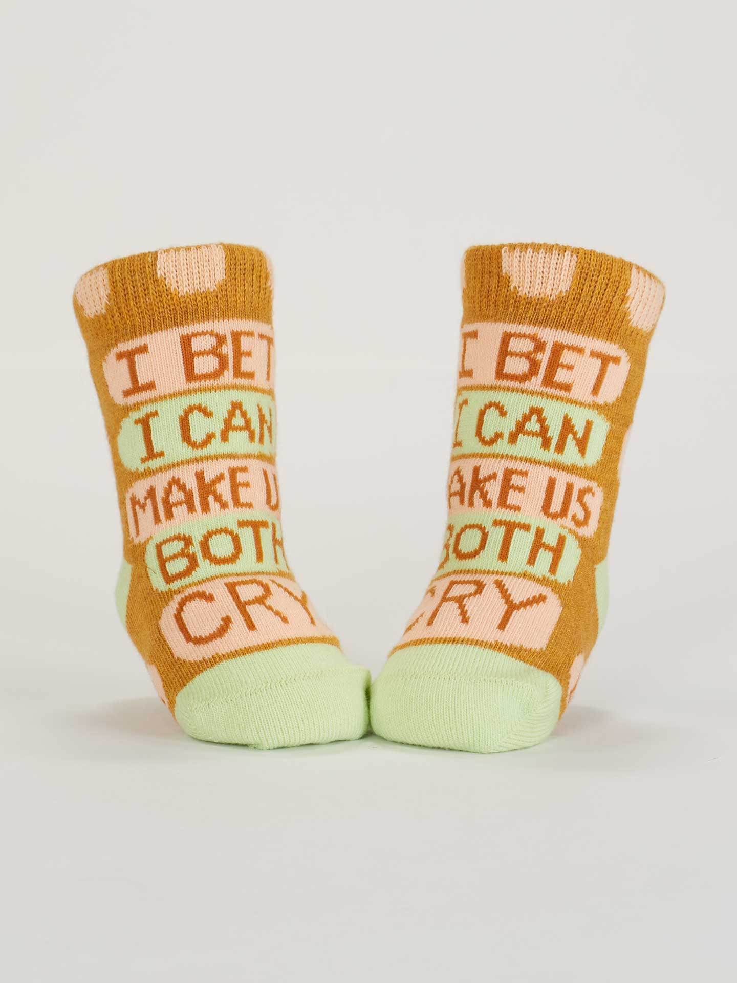Blue Q baby socks featuring Cuddle Bug and Cry Baby designs, soft cotton socks for infants with playful patterns.