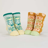 Blue Q baby socks featuring Cuddle Bug and Cry Baby designs, shown from the back view. Soft, colorful sock pair for infants.