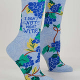 Blue Q ladies crew socks featuring a playful "Don't Not Want Wine" design, in vibrant blue with fun wine-themed graphics.