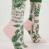 Blue Q ladies crew socks featuring a plant-themed design with the phrase "I Have A Bit Of A Plant Problem" on a light background.