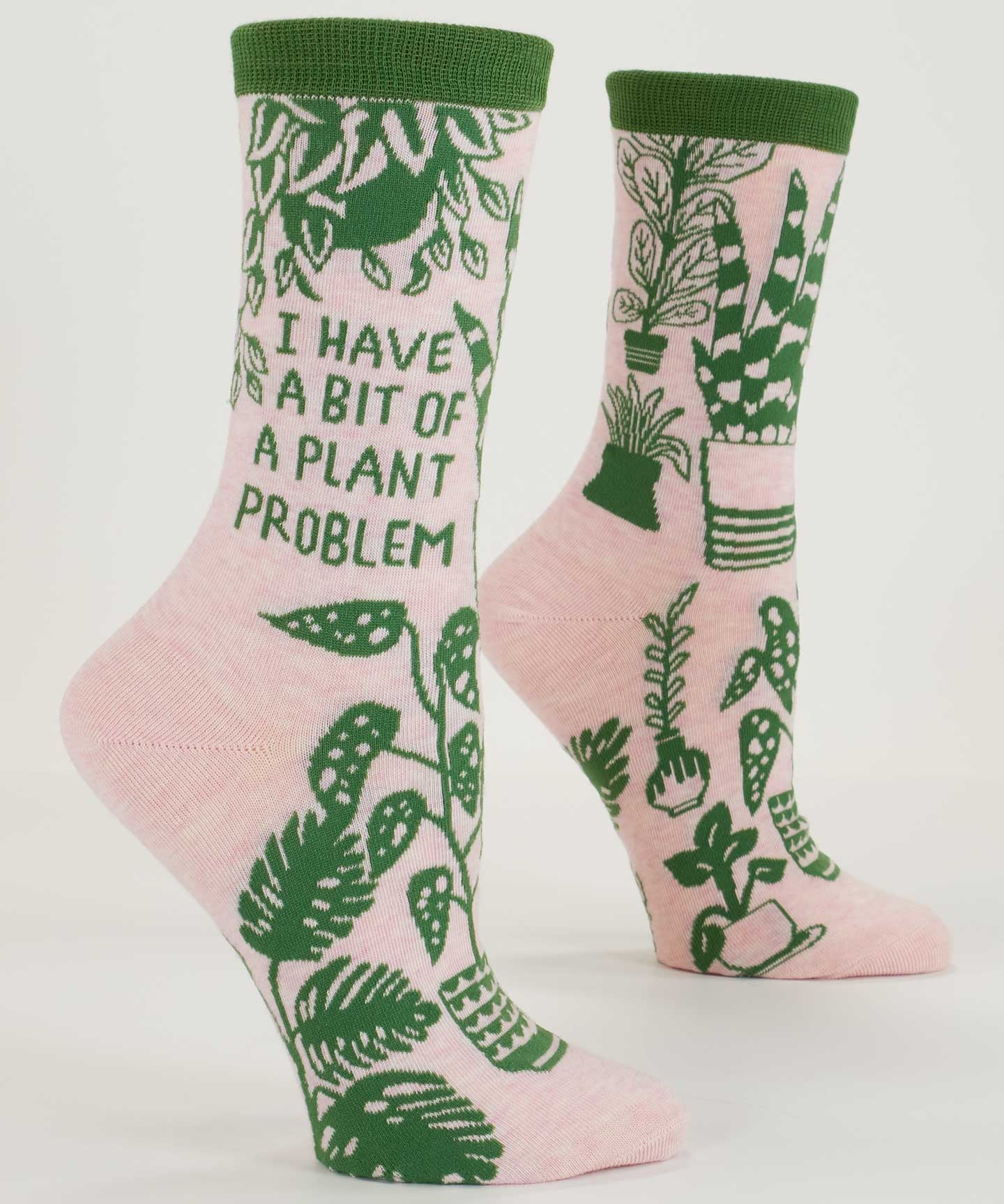 Blue Q ladies crew socks featuring a plant-themed design with the phrase "I Have A Bit Of A Plant Problem" on a light background.