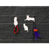 Suck UK Hooks Cat wall hooks shaped like playful cats, black color, mounted on a white wall for functional and decorative use.