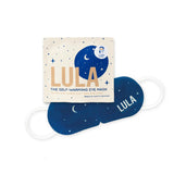 Lula self-warming eye mask in vanilla color, showing soft fabric and ergonomic design for relaxing eye comfort.