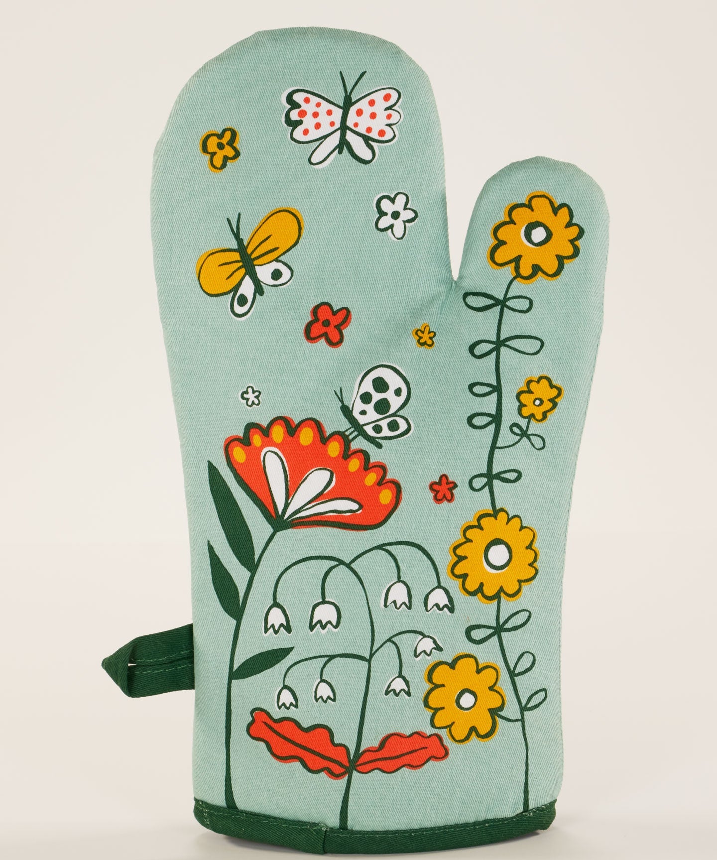 Blue Q oven mitt in the Shitstorm design featuring colorful, humorous graphics for kitchen protection and style.