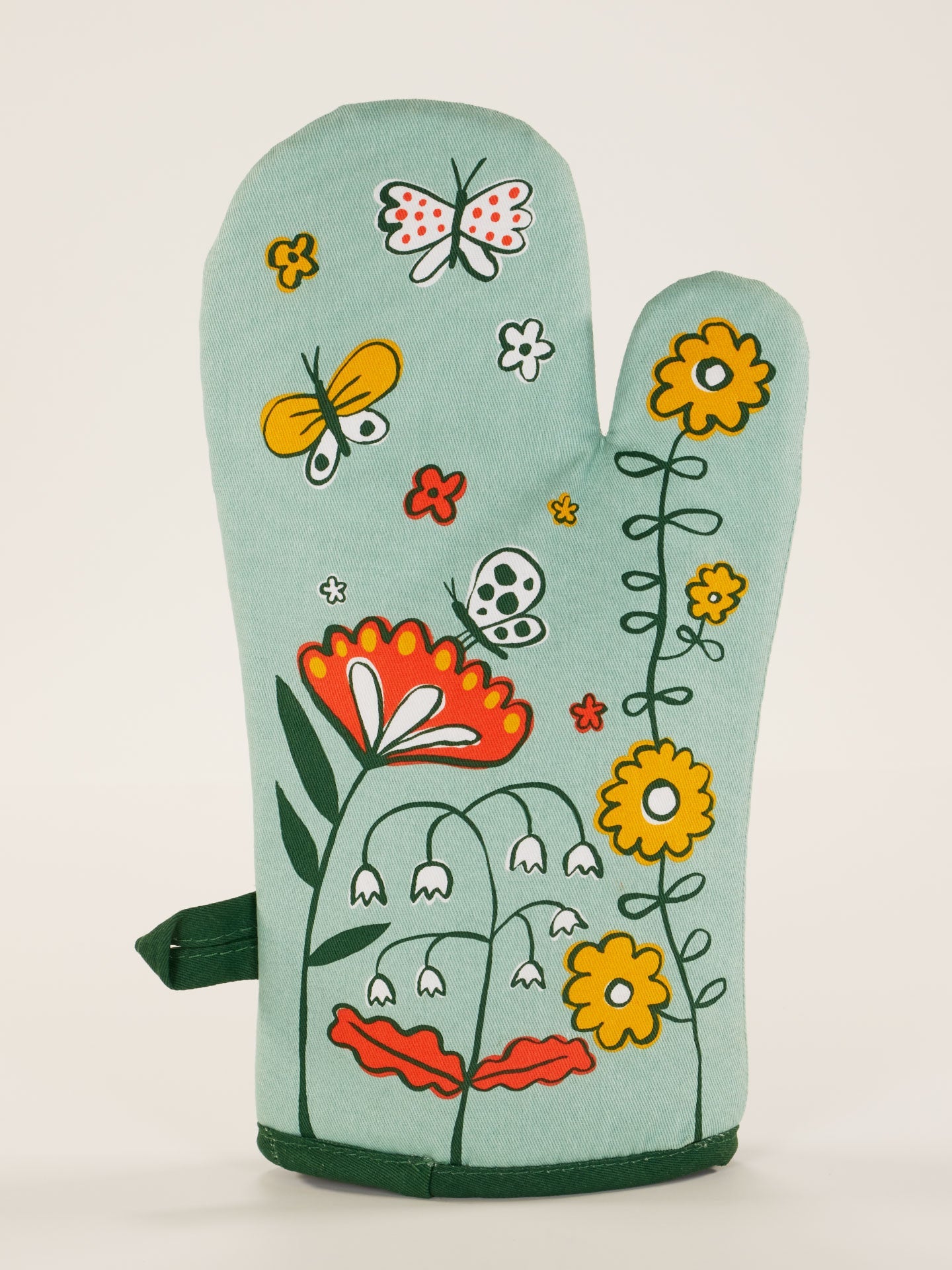 Blue Q oven mitt in the Shitstorm design featuring colorful, humorous graphics for kitchen protection and style.