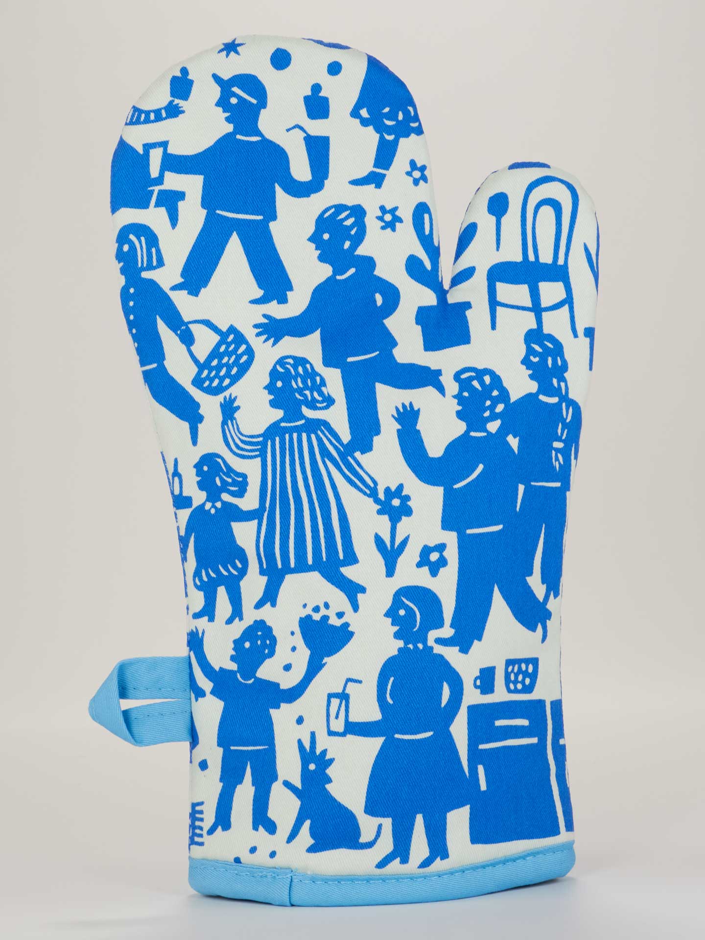 Blue Q oven mitt featuring a colorful party in the kitchen design, made of heat-resistant fabric for safe handling of hot cookware.