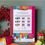 Wild Emery Warm & Bright 12 Days of Christmas shower steamer advent calendar with festive shower bombs in holiday packaging
