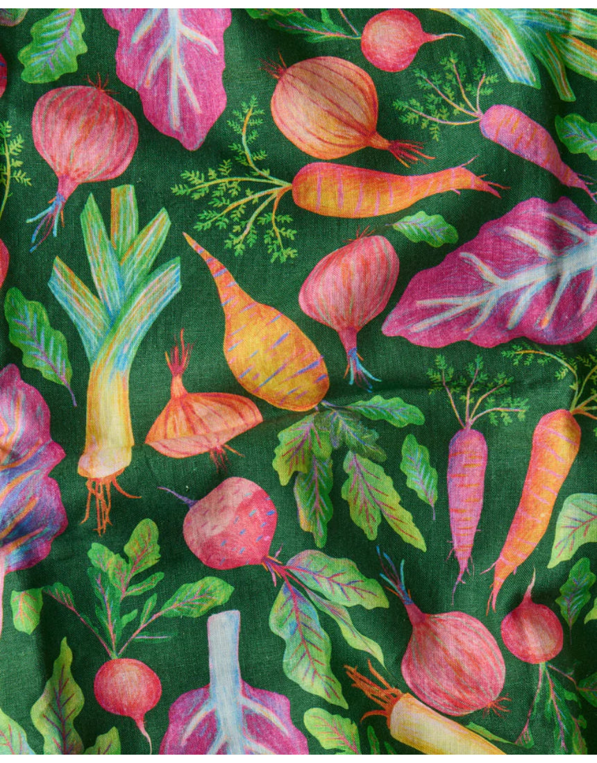 Kip & Co veggie soup apron featuring colorful vegetable print, made of durable fabric, perfect for cooking or gardening.