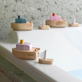 Pink wind-up boat toy for kids from Axis Toys, featuring a small pink boat with a wind-up mechanism.