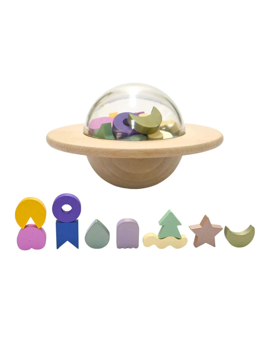 Kids playing the UFO Balance Game by Axis Toys, featuring colorful plastic pieces on a game board for balance challenges.