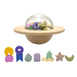 Kids playing the UFO Balance Game by Axis Toys, featuring colorful plastic pieces on a game board for balance challenges.
