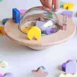 Kids playing with the Axis Toys UFO Balance Game, a colorful kids' balancing game with a UFO theme.