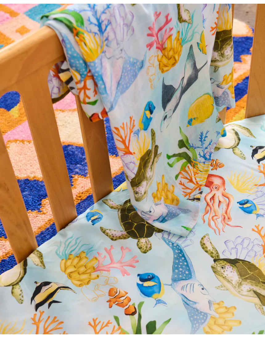 Kip & Co Reef Life bamboo swaddle with vibrant reef-themed design, soft fabric ideal for gentle swaddling of babies.