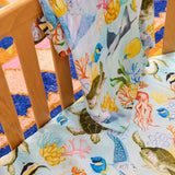 Kip & Co Reef Life bamboo swaddle with vibrant reef-themed design, soft fabric ideal for gentle swaddling of babies.