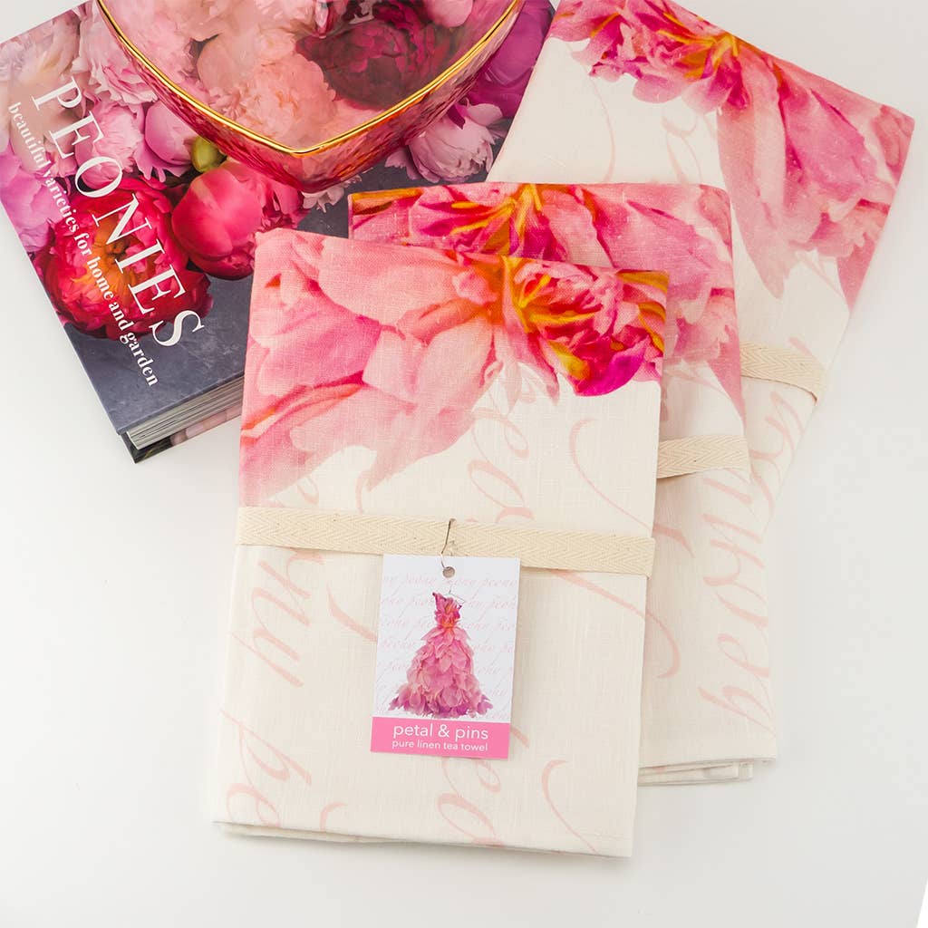 Pink peony floral linen tea towel featuring Petal & Pins brand design with elegant, natural fabric detail.