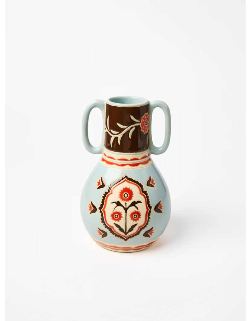 Jones & Co Samira vase with colorful floral arrangement, showcasing decorative ceramic design and vibrant flower display.