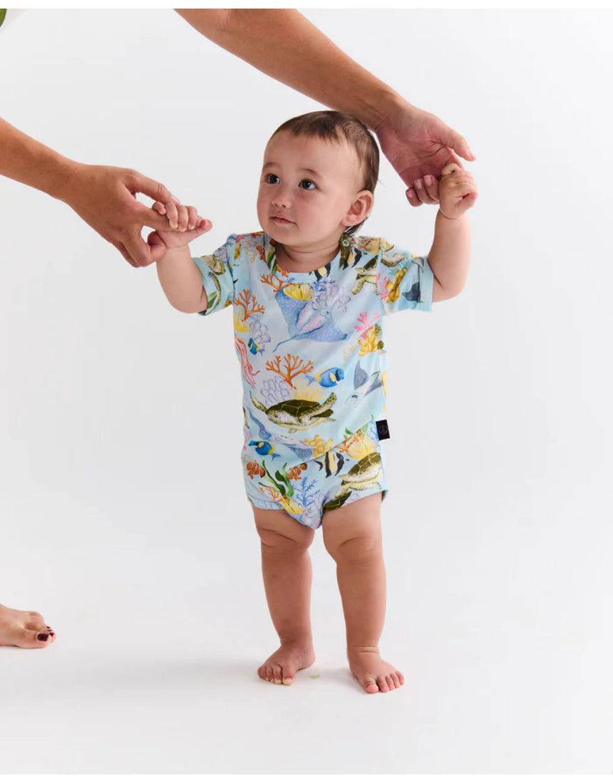 Kip & Co Reef Life short sleeve baby romper with colorful reef and ocean print, lightweight and comfortable for infants.