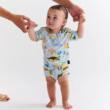 Kip & Co Reef Life short sleeve baby romper with colorful reef and ocean print, lightweight and comfortable for infants.