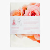 Petal & Pins floral apron featuring a Cécile Brünner Rose design with vibrant, detailed rose patterns on the fabric.
