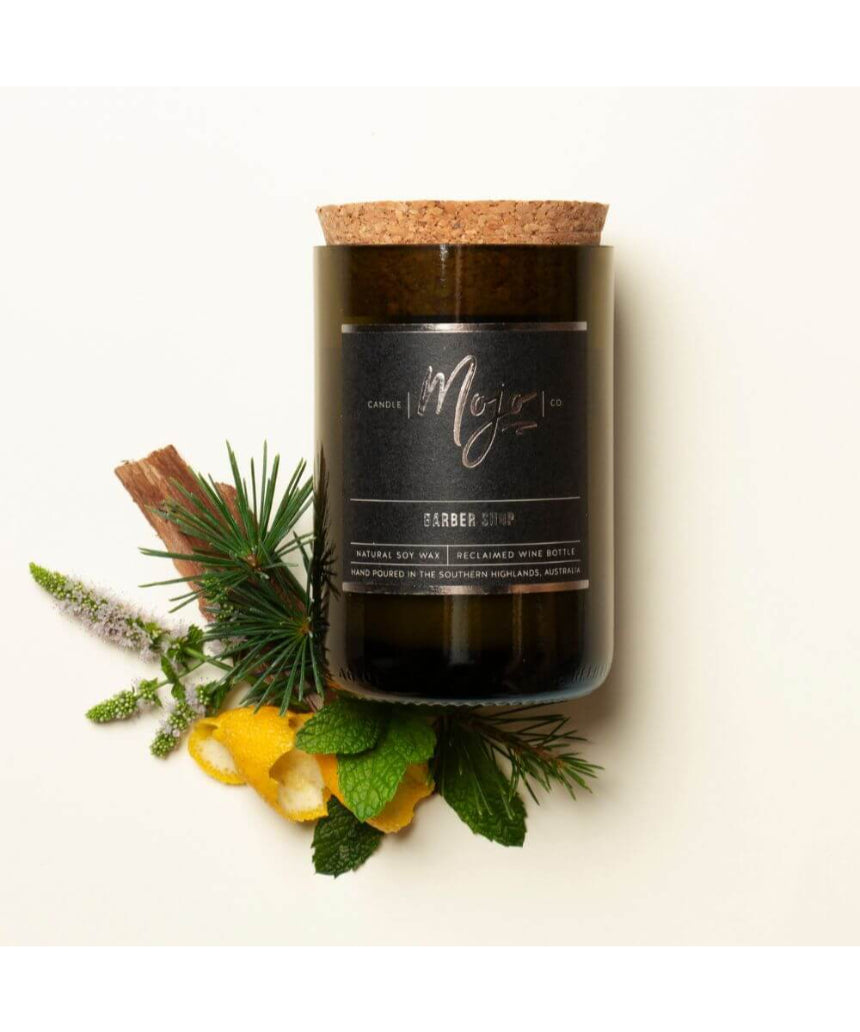 Mojo Candle Co. Barber Shop Black Label candle in a sleek black container, featuring a barber-themed label and a cozy, inviting glow.