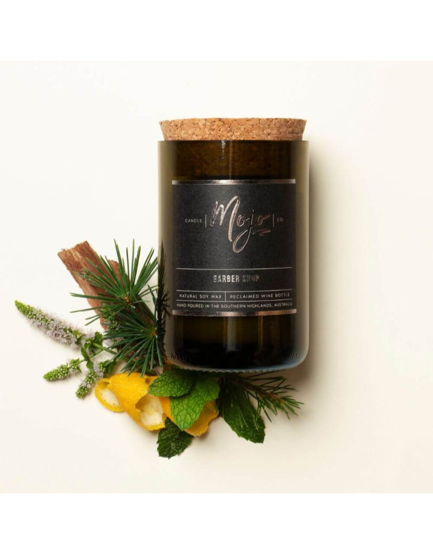 Mojo Candle Co. Barber Shop Black Label candle in a sleek black container, featuring a barber-themed label and a cozy, inviting glow.