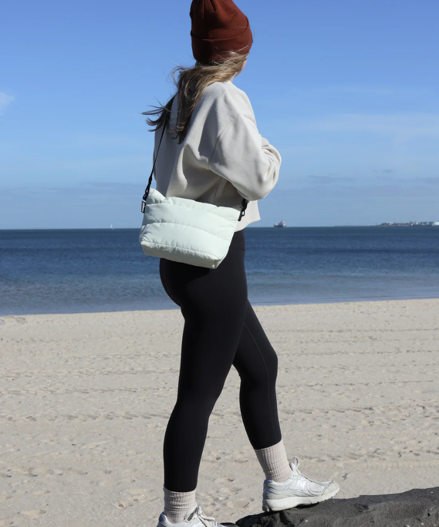 Ecru Crossbody Bag by Base with cloud design, featuring a compact, stylish shape and adjustable strap for everyday use.
