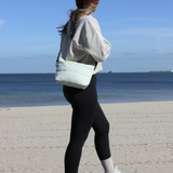 Ecru Crossbody Bag by Base with cloud design, featuring a compact, stylish shape and adjustable strap for everyday use.