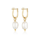 Linda Tahija baroque pearl gold hoop earrings featuring classic round hoops with elegant baroque pearls.