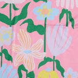 Green Kip & Co cotton knitted blanket with colorful popping flower pattern, soft and cozy for home bedding or lounging.