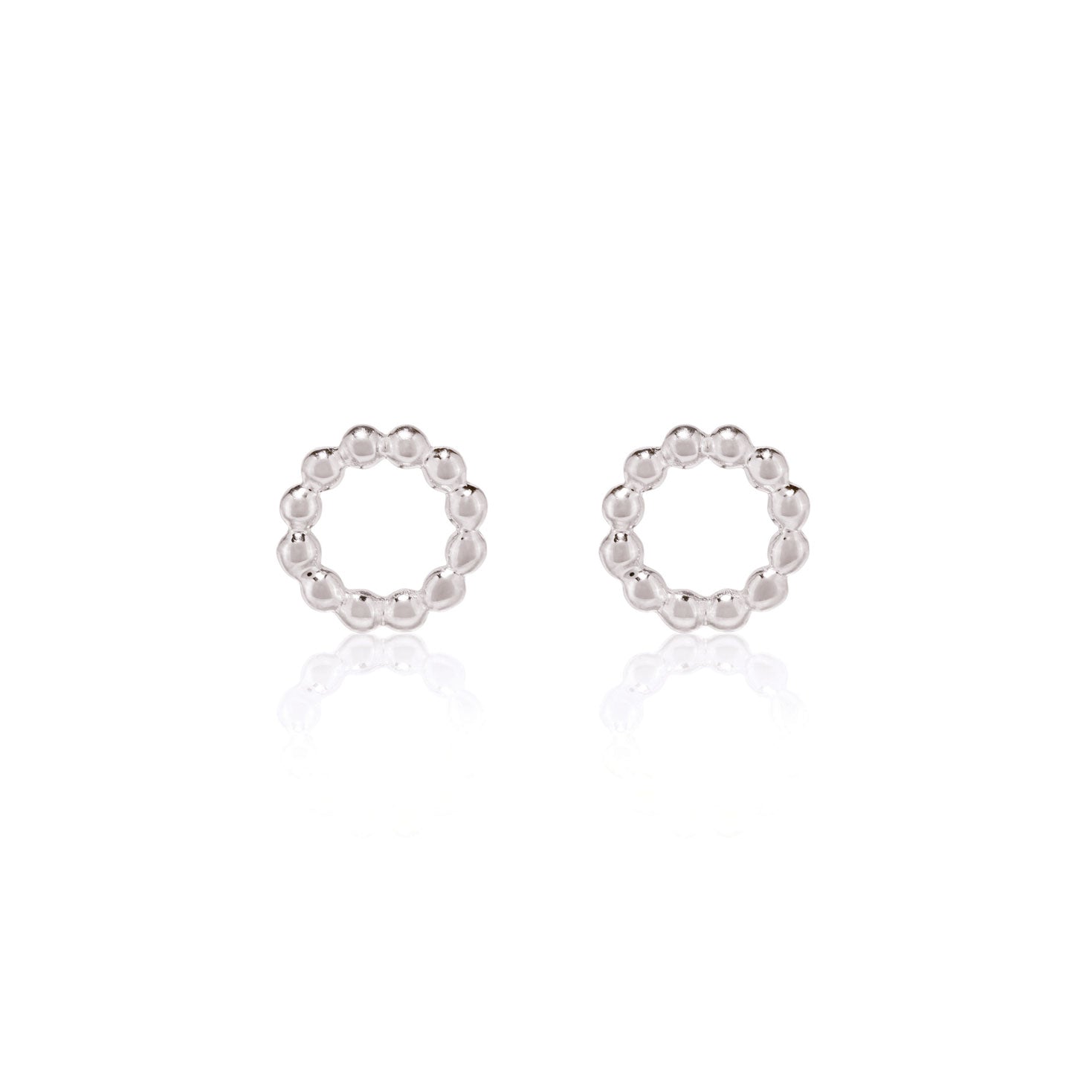 Silver beaded circle stud earrings by Linda Tahija featuring intricate beaded detailing on a sleek stud design.