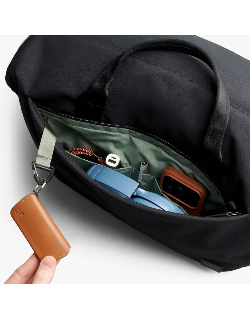 Black Bellroy Classic Duffel 35L bag with sturdy handles and sleek design for travel and daily use.