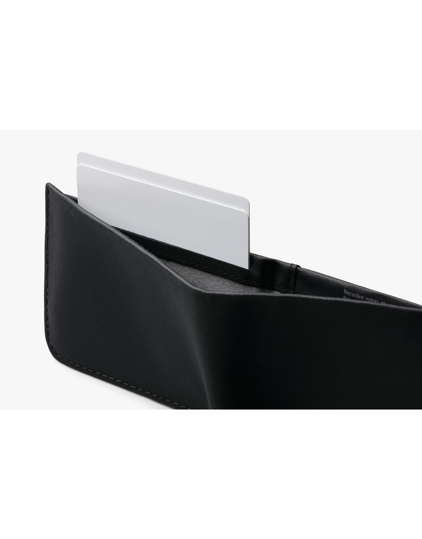 Bellroy Hide & Seek LO INNOVERA™ Edition black wallet with multiple card slots and sleek design, displayed open side view.
