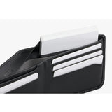 Bellroy Hide & Seek LO INNOVERA™ Edition black wallet with sleek design and multiple card slots, shown open with cards visible inside.