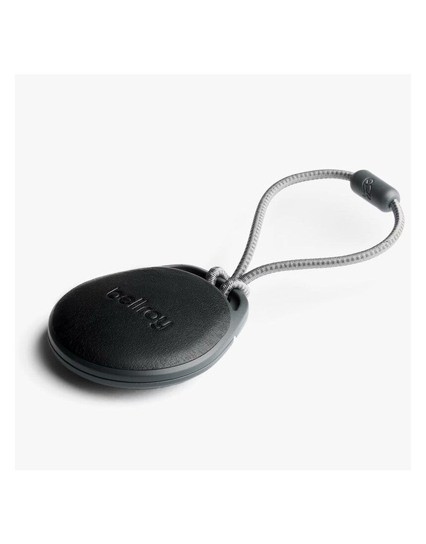 Bellroy black AirTag case with sleek design and secure strap, ideal for attaching to keys or bags.