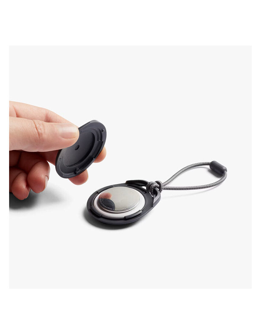 Bellroy black AirTag case with sleek design, compact accessory holder for tracking devices.