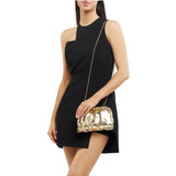 Olga Berg Betty metallic clutch bag in gold with sleek design and compact size, ideal for evening accessories.