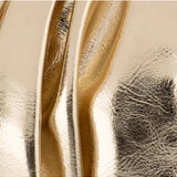 Olga Berg Betty metallic gold clutch bag with a sleek, shiny finish and elegant design for evening occasions.