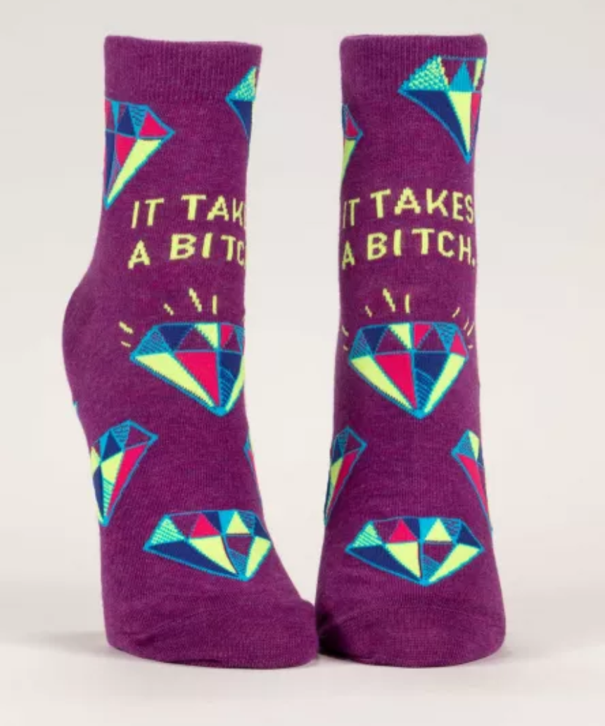 Blue Q ankle socks featuring humorous "It Takes A Bitch" design, casual socks for everyday wear.