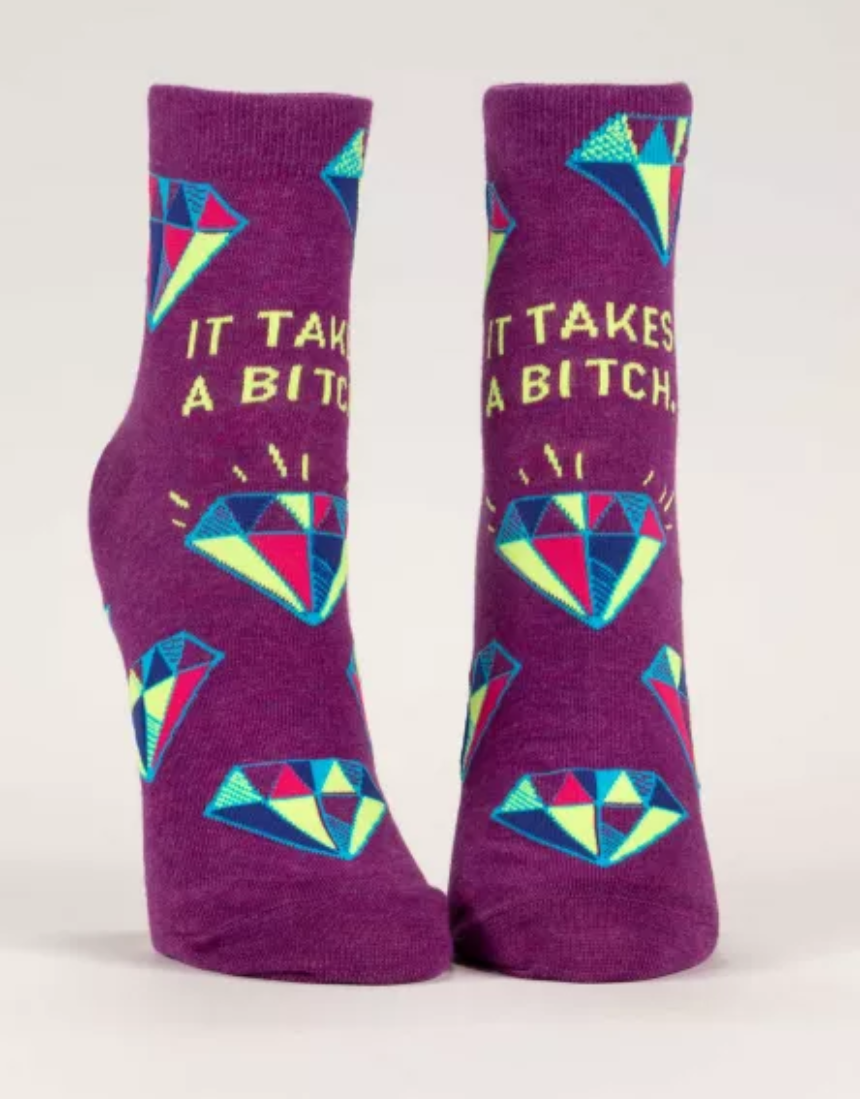 Blue Q ankle socks featuring humorous "It Takes A Bitch" design, casual socks for everyday wear.