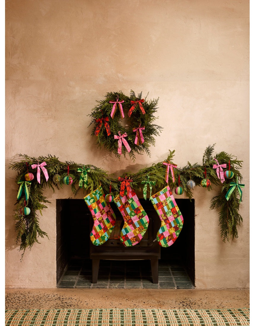 Bonnie and Neil patchwork Christmas stocking with colorful festive fabric panels and hanging loop