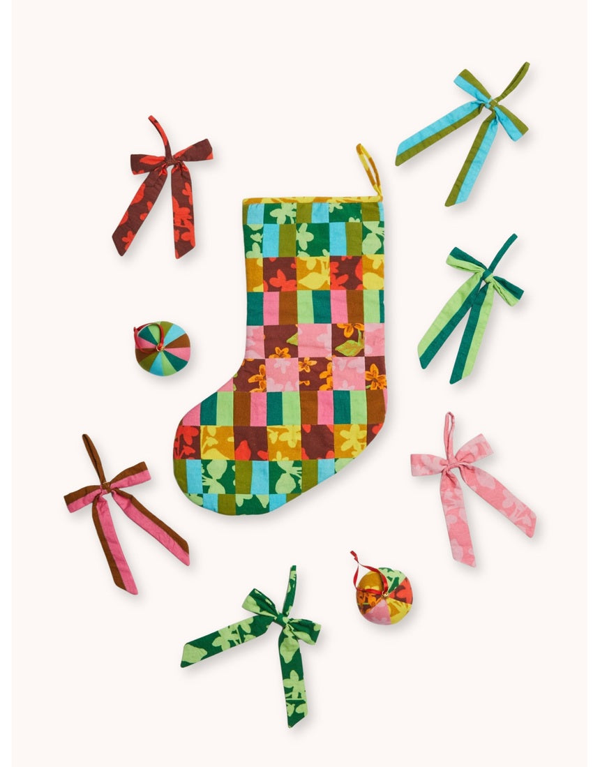 Bonnie and Neil patchwork Christmas stocking with colorful patterned fabric panels