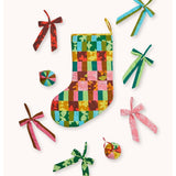Bonnie and Neil patchwork Christmas stocking with colorful patterned fabric panels