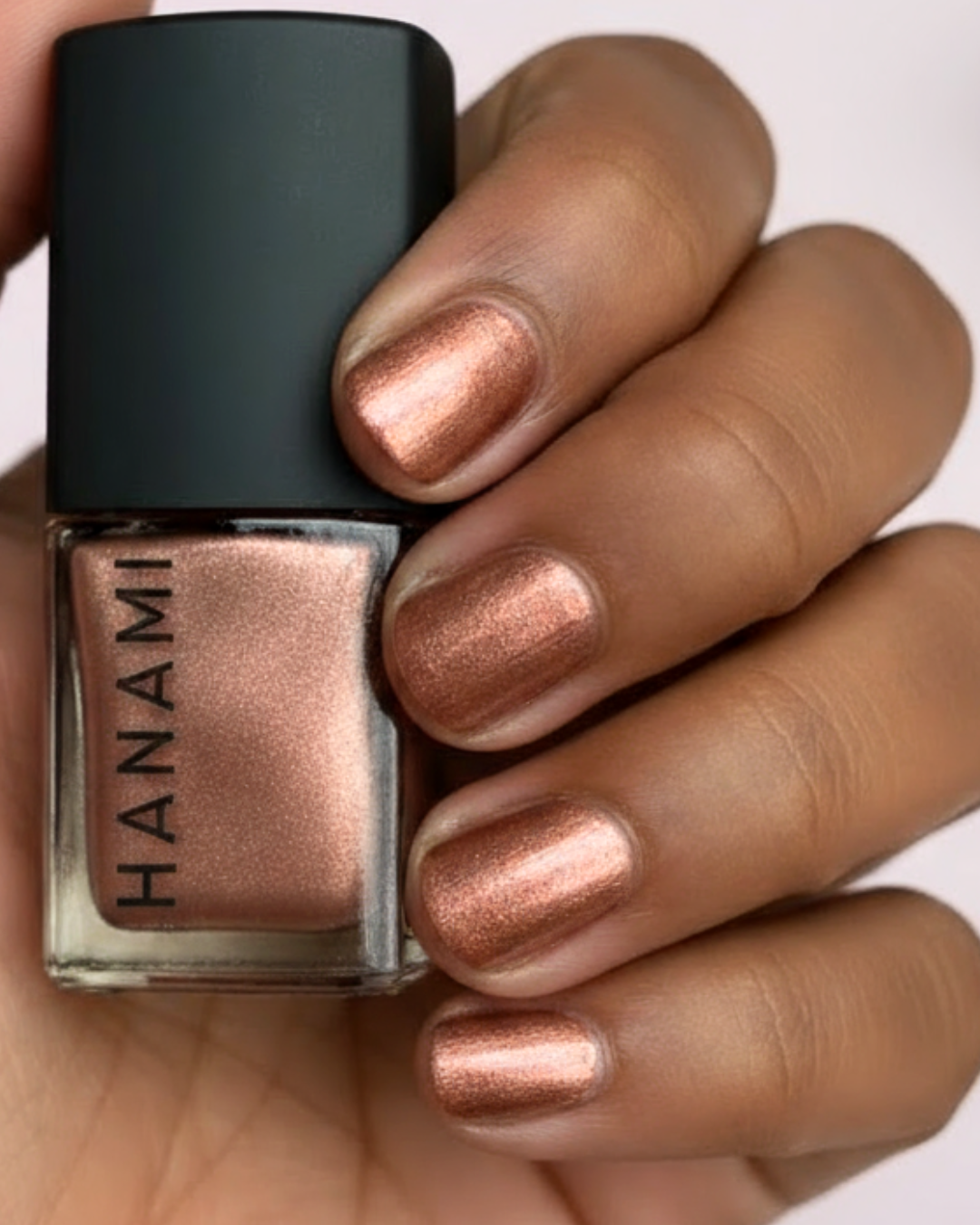 Hanami Cosmetics Rosewood Nail Polish in a rich, deep reddish-brown color with a smooth, glossy finish.