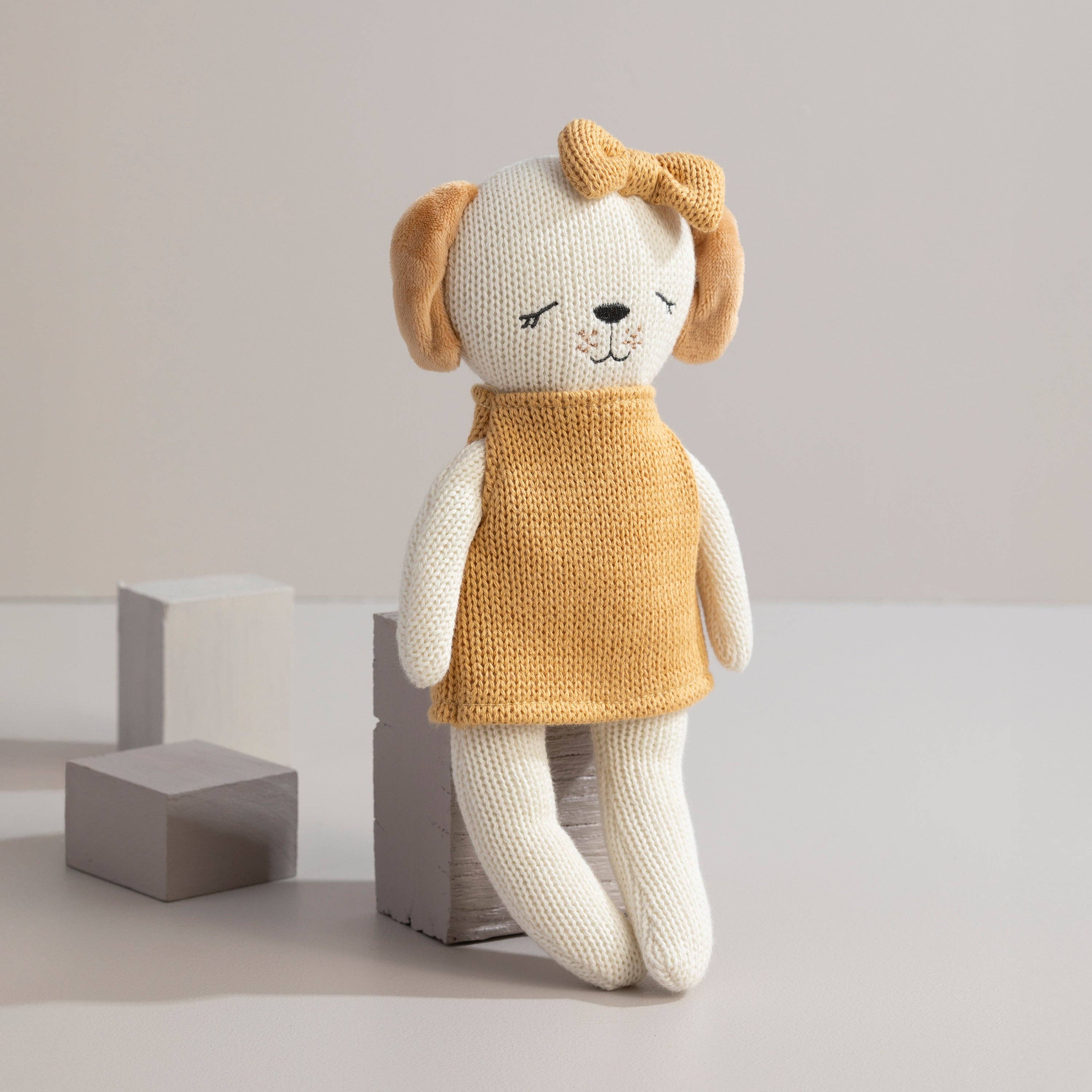 Living Textiles Paula the Puppy knitted animal toy, soft and cuddly plush puppy with detailed knitting, ideal for children.