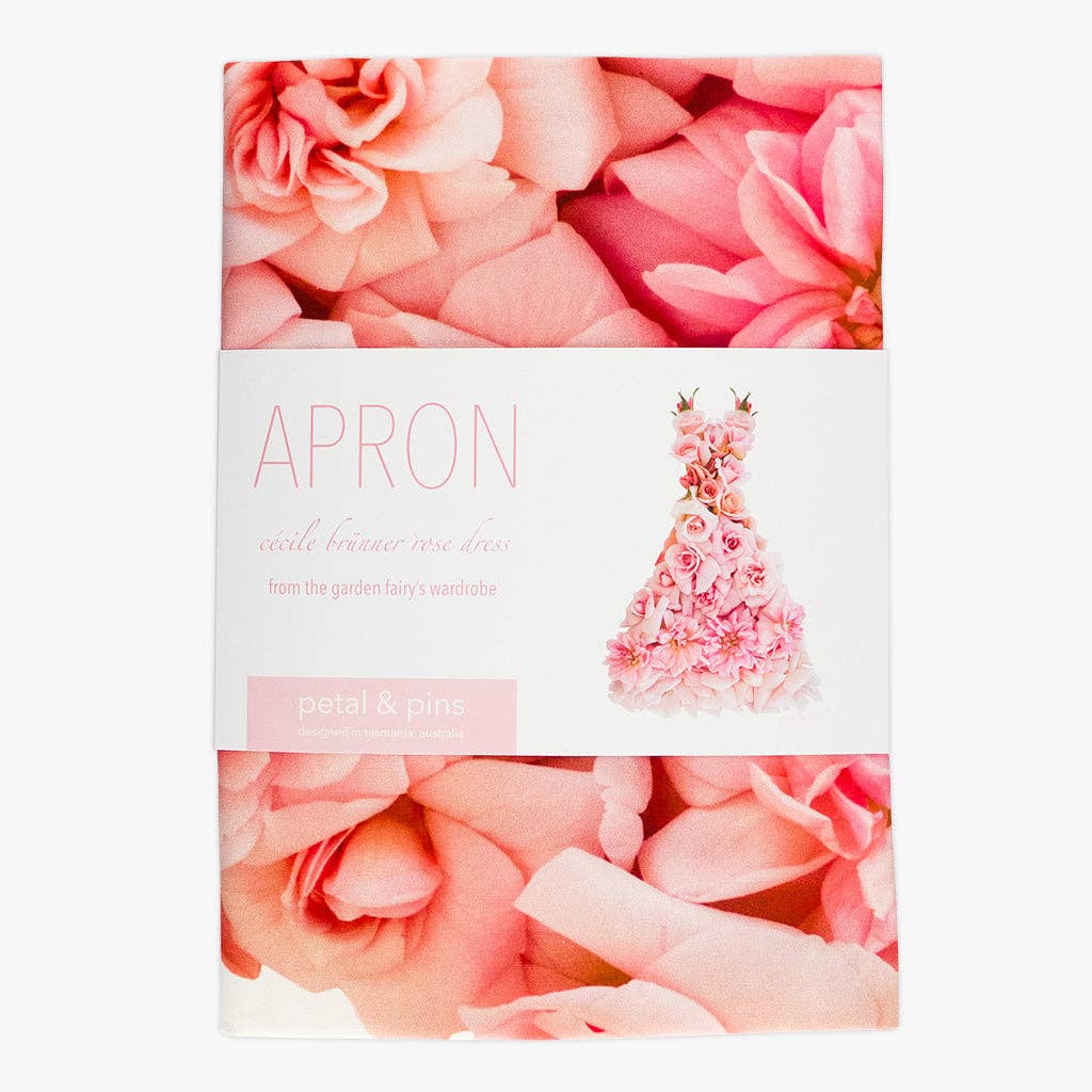 Petal & Pins floral apron featuring a Cécile Brünner rose design with vibrant flower patterns and adjustable ties.