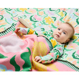 Kip & Co Popping Flowers Green Cotton Knitted Blanket with colorful floral pattern and cozy texture.