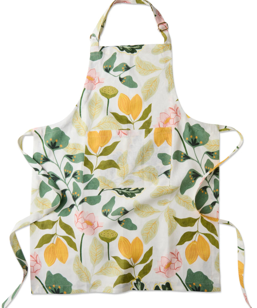Kip & Co Wander apron featuring a colorful, patterned design with adjustable neck strap and large front pocket.