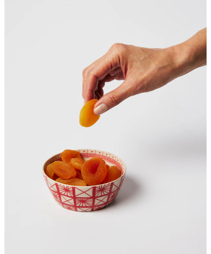 Jones & Co Caravan Snack Bowl in Ruby, a vibrant ceramic bowl with a glossy finish, perfect for serving snacks or small treats.