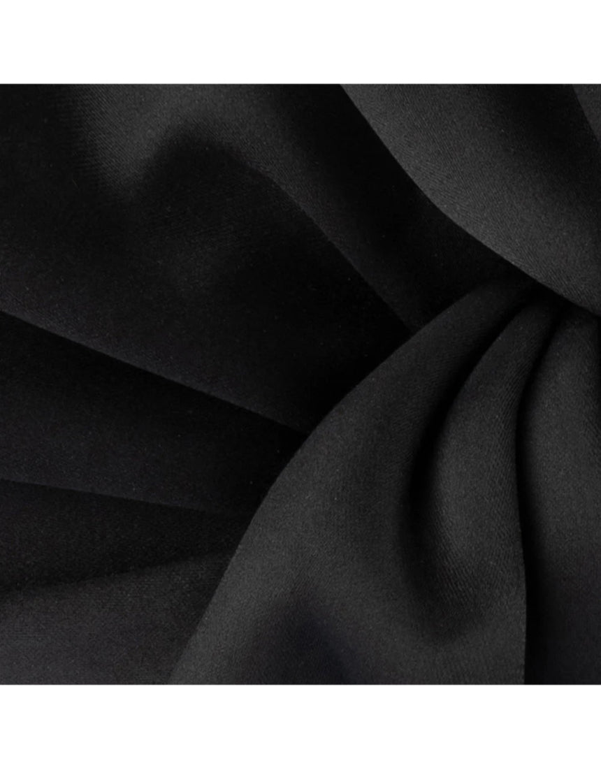 Black Olga Berg Chloe front tie clutch bag with sleek design and elegant front tie detail.